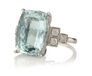 A fine 18ct white gold dress ring featuring a rectangular checkerboard faceted light blue coloured 13ct aquamarine, flanked by six brilliant cut diamonds approximately .46 carats, 7.6 grams total