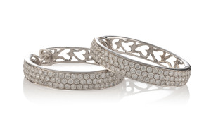 A pair of large 18ct white gold hoop earrings, each pave set with 72 brilliant cut diamonds, stamped "750", diamond weight 3.00 carat, 11.5 grams total