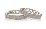 A pair of large 18ct white gold hoop earrings, each pave set with 72 brilliant cut diamonds, stamped "750", diamond weight 3.00 carat, 11.5 grams total