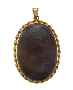 An Australian solid opal pendant in 14ct gold mount, ​4cm high