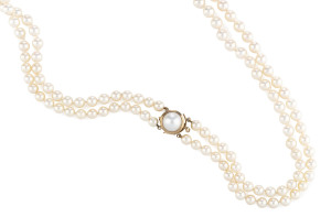 AKOYA CULTURED PEARL NECKLACE Knotted double strand pearls measuring 6.4-7.3mm, cream coloured on 9ct gold clasp, 60cm length