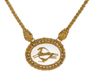 ILIAS LALAOUNIS GREEK GOLD NECKLACE 18ct yellow gold and rock crystal pendant and chain with leaping gazelles and lion masks, stamped "Ilias Lalaounis 750 Greece", length 41.5cm, weight 78.6 grams