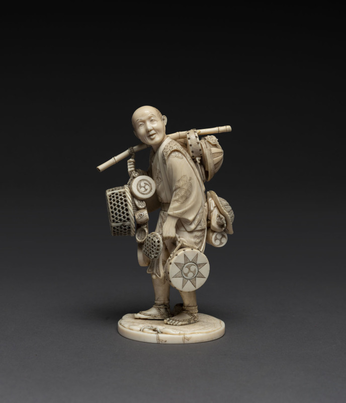 Japanese carved ivory statue of a Ronin Samurai, Meiji period, with red seal mark to base, 14cm high