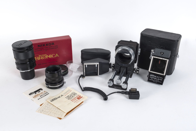 BRONICA: A Nikkor-P 200mm f4 lens [#38290] with caps; Bronica bellows & close-up tubes with instructions; Bronicattl Exposure meter with instructions and accessories in case; prism viewfinder.