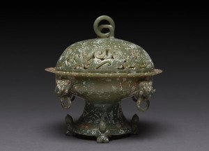 A Chinese carved jade bowl and cover in the Ming style, 19th/20th century,16cm high