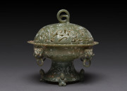 A Chinese carved jade bowl and cover in the Ming style, 19th/20th century,16cm high