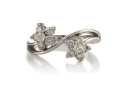 A double floret diamond cluster ring, 18ct white gold set with 12 round brilliant cut diamonds, 4.3 grams