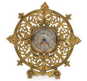 An ornate English table clock by the British United Clock Company of Birmingham, 19th century, ​18cm high