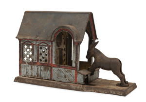 An antique American tinplate moneybox, circa 1879, 22cm long