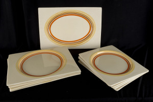 CLARICE CLIFF Nine Art Deco plates, circa 1930s, stamped "Bizarre by Clarice Cliff, The Biarritz, Royal Staffordshire, Great Britain, Regd. No.184849", the largest 30.5cm across