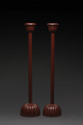 A pair of tall Japanese candle holders, lacquered wood, 20th century, 77cm high