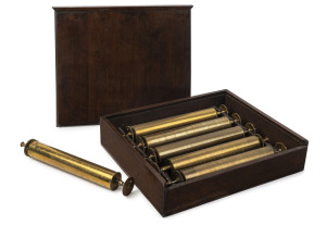 Set of six table model musicbox cylinders, numbered one through six and housed in a walnut cabinet box, 19th century, cylinders 44cm wide