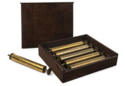 Set of six table model musicbox cylinders, numbered one through six and housed in a walnut cabinet box, 19th century, ​cylinders 44cm wide