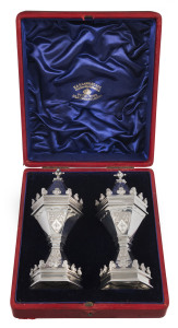A superb pair of English sterling silver pepper pots made for Queen Victoria's Diamond Jubilee, originally a present from the Salters Company and bearing their crest, manufactured by GARRARD & Co. Maker's to the Queen, London, circa 1897, in original plush fitted box, 13cm high, 380 grams total