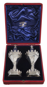 A superb pair of English sterling silver pepper pots made for Queen Victoria's Diamond Jubilee, originally a present from the Salters Company and bearing their crest, manufactured by GARRARD & Co. Maker's to the Queen, London, circa 1897, in original plus