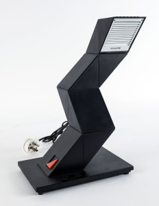 A "Z-LITE" flexible desk lamp, circa 1970s, by Leuchten AG. The light consists of a stable base and six triangular revovable elements. Accompanied by original Operational Manual in English.