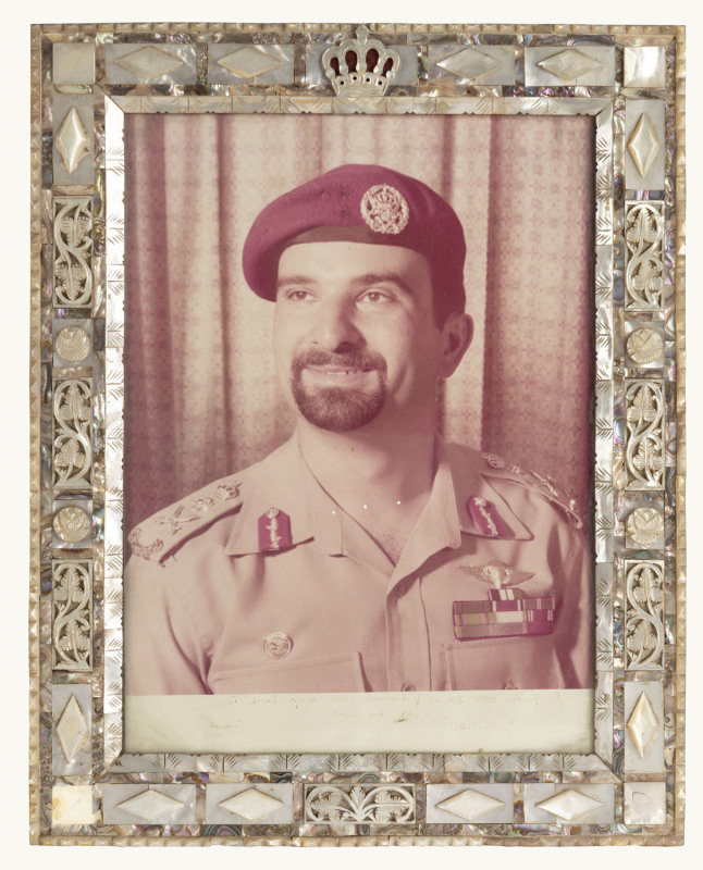 Crown Prince Hussein of Jordan, photgraphic portrait in mother-of-pearl inlaid frame. The dedication at the base is somewhat faded. Overall 41.5 x 33cm.