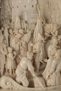 A superb German carved ivory panel depicting a medieval triumphant return with thronging crowds amidst a castle backdrop and harbour scene, housed within a fine tortiseshell frame inlaid with florets of mother of pearl and bound again in ivory with leathe - 2