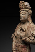 An 18th century Chinese carved wood and polychromed figure of Guan Yin adorned with an elaborate headress and standing on a rocky outcrop, later wooden plinth mounted for a lamp added in the early 20th century, 85.5cm high, PROVENANCE: Christie's, Melbou - 2