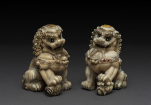 A pair of Chinese Dogs of Fo, carved ivory with remains of parcel gilding and red enamel, Chien Lung Period (1736-1795), 10.5cm high. PROVENANCE :John Williams Auctions, house sale, September 1994