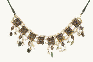 An antique Polki gold necklace, featuring seventy-nine uncut diamonds, pearls and other stones; circa 1900.  