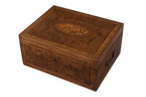 A George III ladies travelling dressing case workbox, satinwood, hare wood, blackthorn marquetry inlay, interior sumptuously adorned in matching marquetry with original silk lining. Remarkably, still containing original gilded silver thread barrels and filagree boxes, also contains assorted ivory handled sewing accessories including a fitted ivory spindle or reel holder. Exceptionally fine and rare and in remarkable condition. Inspection a must 17cm high, 36cm wide, 28cm deep PROVENANC
