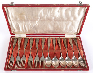 A set of silver teaspoons and cocktail forks in original box; foliage design to handles. (12 pieces).