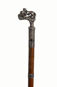 An antique fox hunting riding crop adorned with a silver top in the form of a fox and pheasant, 19th century, 75cm long
