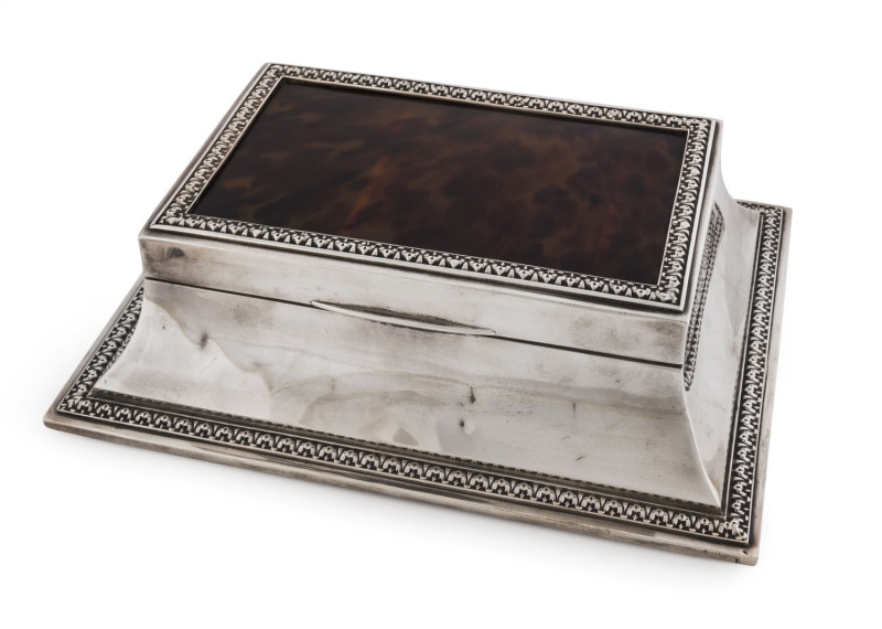 A George V sterling silver mounted tortoiseshell cigar box with shaped sides and chaised edge decoration. By Hardy Brothers, London, circa 1913. 8cm high, 26cm wide, 19cm deep PROVENANCE: Romayne Munro (nee Hordern) of Point Piper and Milton Park, Bow