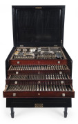 An English sterling silver cutlery set originally for 18 people with servers and accessories. ​By Frederick Elkington of London, circa 1888, housed in a four tier canteen cabinet with ebonized finish. Missing one spoon and one knife blade. 12kg plus of s