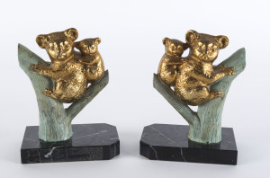 A pair of French Art Deco koala bookends, patinated spelter and marble, circa 1930s, 16cm high