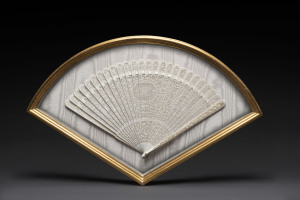 An ornate ivory folding fan mounted in gilt box frame, 19th century, with original fan box as well, 55cm across