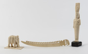 An African ivory Pharaoh statue, Indian ivory elephant statue and a letter opener, early 20th century, ​the Pharaoh statue 21cm overall