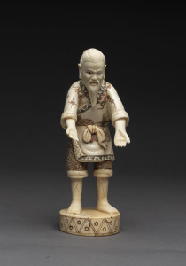 A Chinese carved and painted bone figure of a man, 20th century, 20cm high