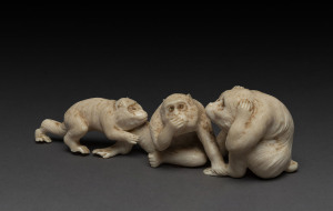 A Japanese carved ivory figure group of three monkeys, early 20th century, 17cm long