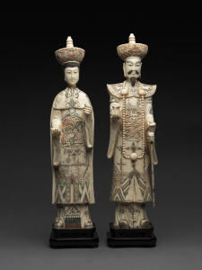 A pair of ancestral figures, carved and painted bone, 20th century, 51cm overall