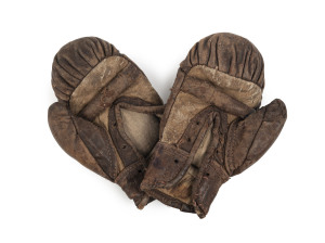 A pair of antique boxing gloves in childrens size, late 19th/early 20th century, 15cm high