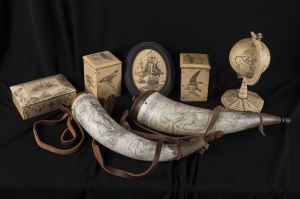 Two reproduction powder horns, miniature globe, boxes and picture, late 20th century, the horns 32cm long
