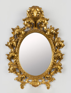 A Rococo style gilt framed oval mirror, 20th century, 67cm x 49cm