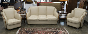 An English Art Deco three piece cloud lounge suite designed by HARRY AND LOU EPSTEIN bone leather with walnut trim, circa 1935