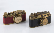 CAMERAS, MOVIE PROJECTORS and other photographic equipment. An accumulation in very mixed condition; noted two "gold" copy Leicas. (Qty.).