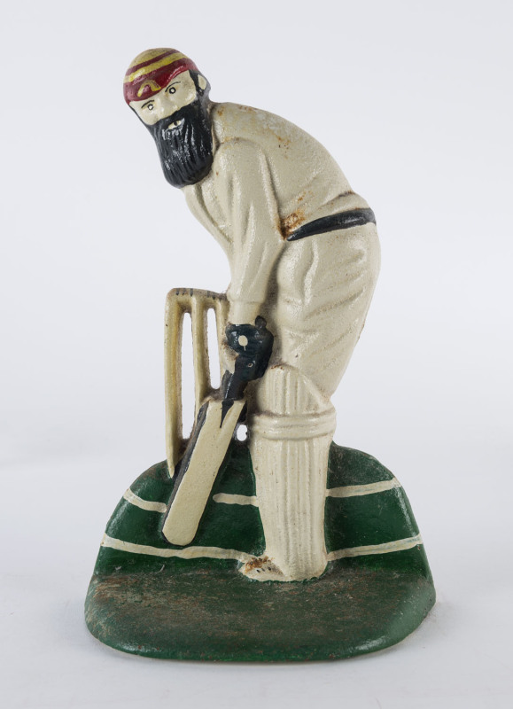 W.G. Grace cast iron door stop; 23mm tall.