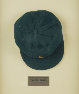 ZAHEER ABBAS' PAKISTAN TEST CAP, green wool with the five-armed star logo of the Pakistan Cricket Board embroidered to front. Made by Naeem Cap Industry, with "Z" in pen on the label and "ZAHEER" in pen on the plastic lining. Very fine condition and attractively framed.