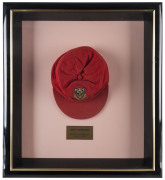 JEFF HAMMOND'S SOUTH AUSTRALIA CRICKET CAP, baggy red with embroidered badge on front, endorsed inside "Ham". Attractively framed. [Hammond played in 5 Tests 1972-73, and played for South Australia between 1969 and 1981]. Provenance: Leski Auctions, Augus - 2