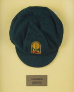 DAVID BOON'S TASMANIAN CRICKET CAPBaggy Green, with embroidered Tasmanian Tigers logo to front (cricket ball and stumps over a Tasmanian Tiger), signed inside by David Boon. Attractively framed. [David Boon played 107 Tests 1984-96, and represented Tasman