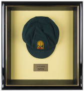 DAVID BOON'S TASMANIAN CRICKET CAPBaggy Green, with embroidered Tasmanian Tigers logo to front (cricket ball and stumps over a Tasmanian Tiger), signed inside by David Boon. Attractively framed. [David Boon played 107 Tests 1984-96, and represented Tasman - 2