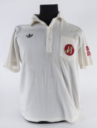 KIM HUGHES, short-sleeved team shirt from the Australian Team he captained to the unofficial Rebel Tour of South Africa 1985-86.&nbsp;Provenance: The Kevin O'Dowd Collection.