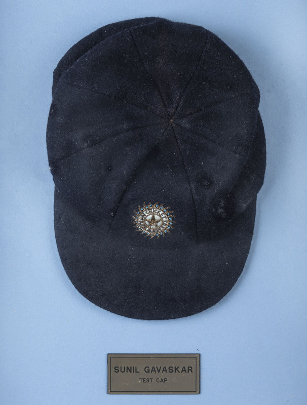 SUNIL GAVASKAR'S INDIAN TEAM TEST CAP, with "INDIAN CRICKET TEAM" and star embroidered to front. Attractively framed. [Between 1971 and 1987 Gavaskar played in 125 Test matches, accumulating 10,122 runs at an average of 51.12].