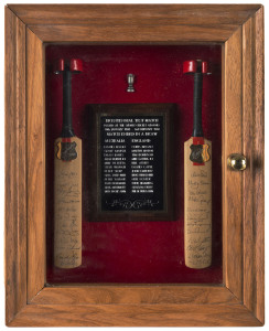 THE BI-CENTENNIAL TEST MATCH, SYDNEY, Jan/Feb.1988An attractively presented display comprising of two miniature bats, each with a metal engraved plaque, one signed by the Australian team, the other signed by the English team, and between the bats an engraved plaque naming the members of both teams and providing details of the match....which ended in a draw.