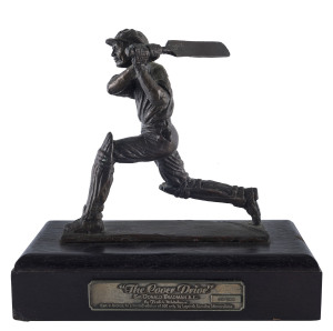 A bronze statuette of Donald Bradman batting, titled 'The Cover Drive' by Frederic Whitehouse, ed. 49/500. With original, signed Certificate of Limitation. 18cm tall.Not to be confused with the pewter version of this statuette, issued in an edition of 5,000.
